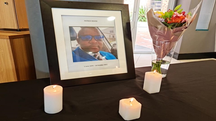 A picture of Patrick Mgoqi surrounded by candles at the SABC Western Cape office.