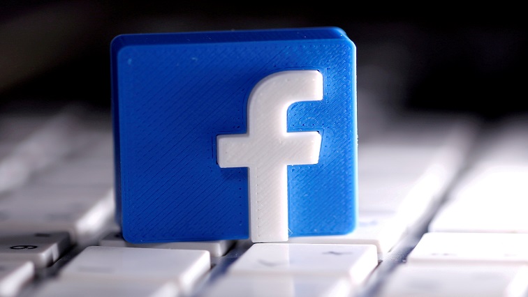 A 3D-printed Facebook logo is seen placed on a keyboard in this illustration. [File image]