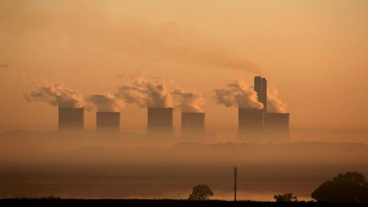 Steam rises at sunrise from the Lethabo Power Station, a coal-fired power station owned by state power utility Eskom near Sasolburg.
