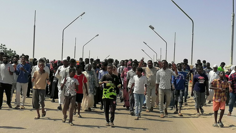 Sudanese demonstrators march and chant during a protest against the military takeover, in Atbara, Sudan October 27, 2021 in this social media image. [File image]