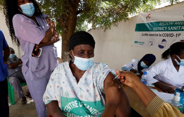 A health worker receives a dose of coronavirus disease (COVID-19) vaccine in Dakar, Senegal February 24, 2021.