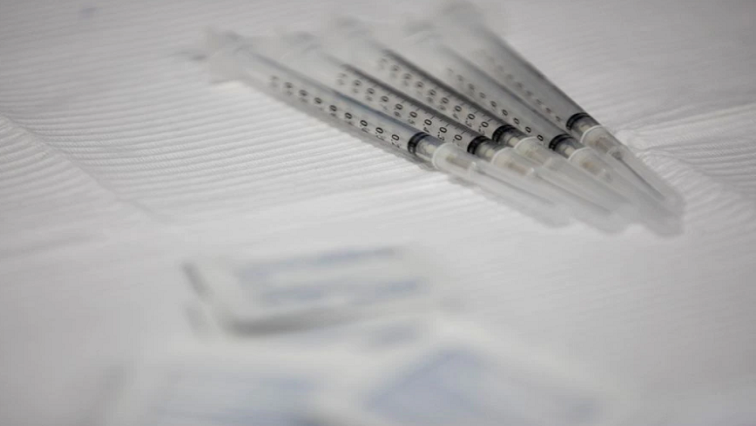 Syringes filled with the Pfizer-BioNTech vaccine sit on table during vaccine clinic in Southfield, Michigan, US, September 29, 2021.