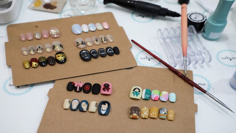 Samples of Squid Game's manicure are displayed at the nail salon Maniqure in Kuala Lumpur, Malaysia October 14, 2021.