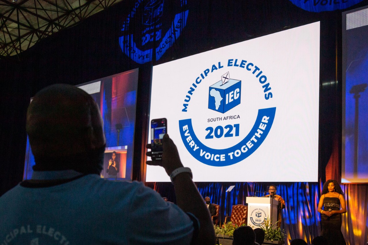An attendee takes a photograph during the Independent Electoral Commission’s launch of the Results Operation Centre in Pretoria, 26 October 2021. The centre will coordinate the final results of the 2021 Municipal Elections as the voting day of 1 November approaches.