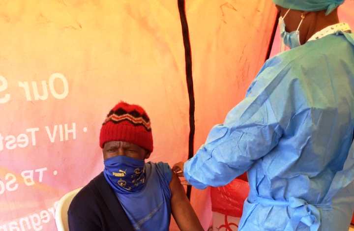 A nurse administering a COVID-19 vaccination at a SA government vaccine site