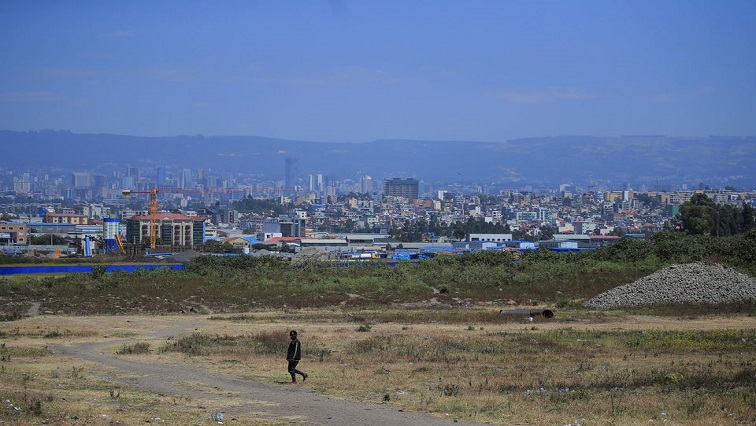 A man walks on the outskirts of Addis Ababa, Ethiopia, November 5, 2021.