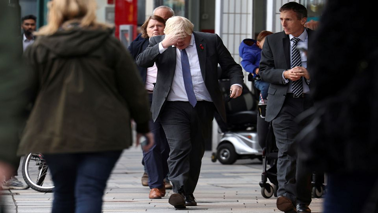 British Prime Minister Boris Johnson arrives at a COVID-19 vaccination centre at a pharmacy in Sidcup, London, Britain, November 12, 2021.