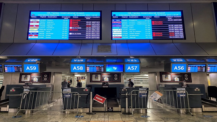 Digital display boards show cancelled flights to London - Heathrow at O.R. Tambo International Airport in Johannesburg, South Africa, November 26, 2021.