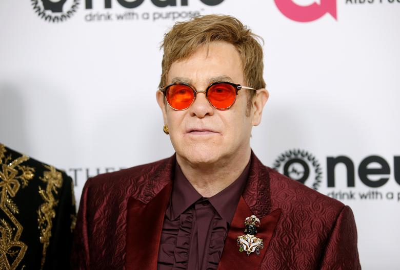 Singer Elton John  poses at his 70th Birthday and 50-Year Songwriting Partnership with Bernie Taupin event, benefiting the Elton John AIDS Foundation and the UCLA Hammer Museum at RED Studios Hollywood in Los Angeles, March 25, 2017.
