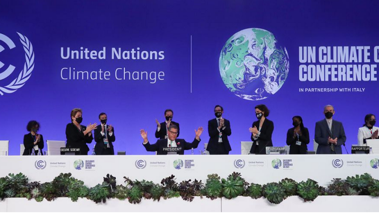 COP26 President Alok Sharma gestures as he receives applause during the UN Climate Change Conference (COP26) in Glasgow, Scotland, Britain November 13, 2021.