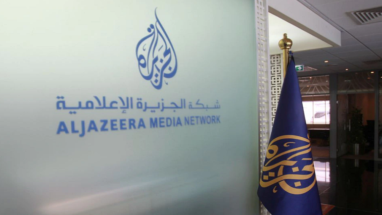 The Al Jazeera Media Network logo is seen inside its headquarters in Doha, Qatar.
