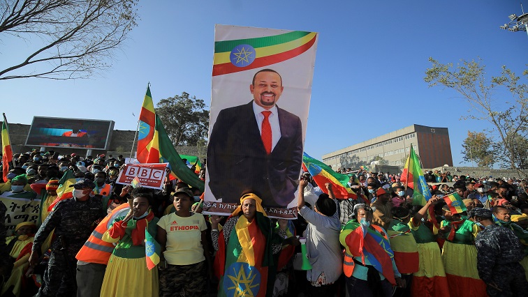 Civilians carry a placard with Prime Minister Abiy Ahmed’s portrait during a pro-government rally to denounce what the organisers say is the Tigray People’s Liberation Front (TPLF) and the Western countries' interference in internal affairs of the country, at Meskel Square in Addis Ababa. [File image]