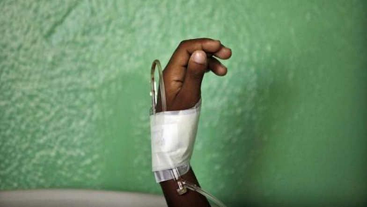 File photo: A bandaged hand with a medical drip.