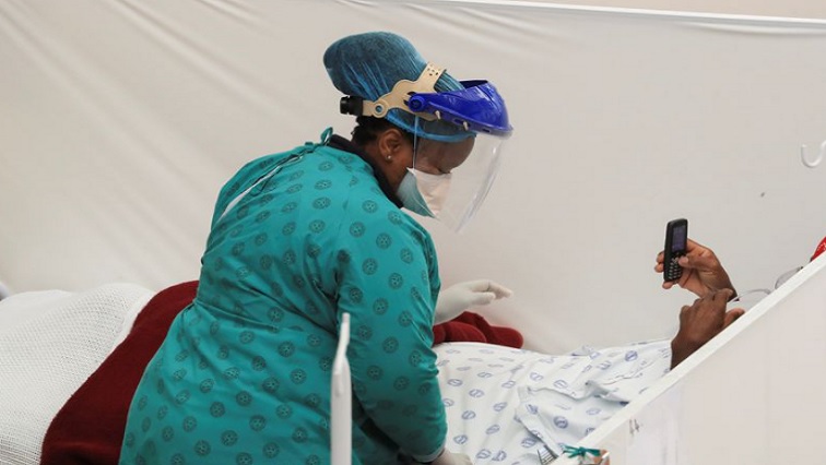 A patient being attended to by a nurse in a hospital
