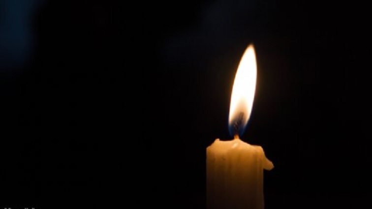 A candle is used during load shedding in South Africa.