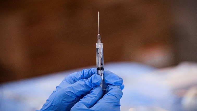A syringe is filled with a dose of Pfizer's COVID-19 vaccine at a pop-up community vaccination center at the Gateway World Christian Center in Valley Stream.