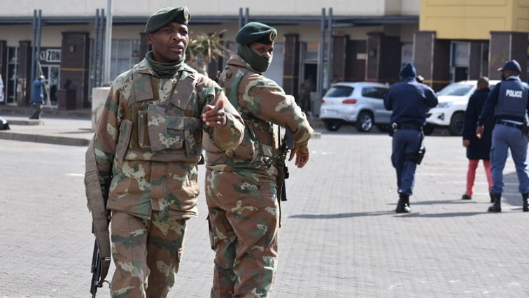 File image of soldiers and the police patrolling the Chris Hani Mall in Gauteng, on July 15, 2021.