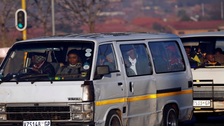 A taxi full of passengers on a South African road.