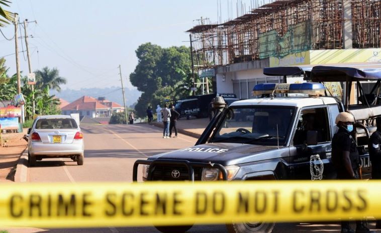 Ugandan police members secure the scene of an explosion in Komamboga, a suburb on the northern outskirts of Kampala, Uganda October 24, 2021.