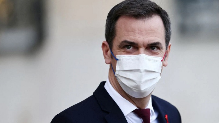 French Health Minister Olivier Veran, wearing a protective face mask, leaves following the weekly Cabinet meeting at the Elysee Palace in Paris, France, December 1, 2021.