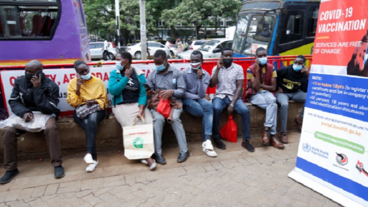 Civilians queue to receive the coronavirus disease (COVID-19) vaccine at a makeshift tent as the government orders for proof of vaccination to access public places and transport, in downtown Nairobi, Kenya December 23, 2021.