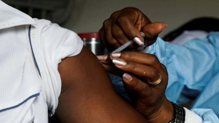 A man receives a vaccine against the coronavirus disease (COVID-19) in a vaccination truck at a mobile vaccination center in Abidjan, Ivory Coast September 23, 2021.