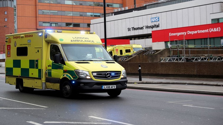 An ambulance drives past St Thomas' Hospital as the spread of the coronavirus disease (COVID-19) continues, in London, Britain, December 12, 2021.