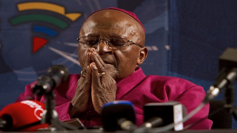 Archbishop Emeritus and Nobel Laureate Desmond Tutu pays tribute to Nelson Mandela during a news conference in Cape Town December 6, 2013.