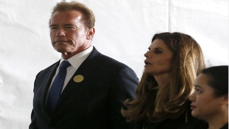 Former California Governor Arnold Schwarzenegger (L) and Maria Shriver walk to the grave site at the funeral of Nancy Reagan at the Ronald Reagan Presidential Library in Simi Valley, California, United States, March 11, 2016.