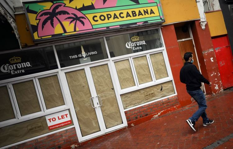 A man walks past a restaurant closed during the coronavirus disease  outbreak as the country faced tougher lockdown restrictions in Cape Town, South Africa, June 28, 2021.