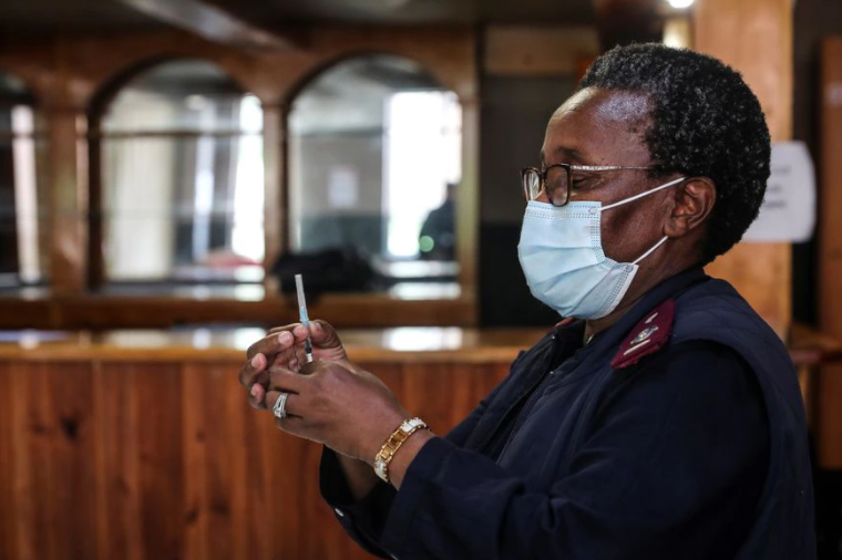 A healthcare worker prepares a dose of the Pfizer coronavirus disease (COVID-19) vaccine, amidst the spread of the SARS-CoV-2 variant Omicron, in Johannesburg, South Africa, December 9, 2021.