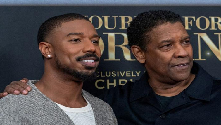 Michael B. Jordan and Denzel Washington pose during the red carpet premiere of "A Journal for Jordan" in New York City, US December 9, 2021.