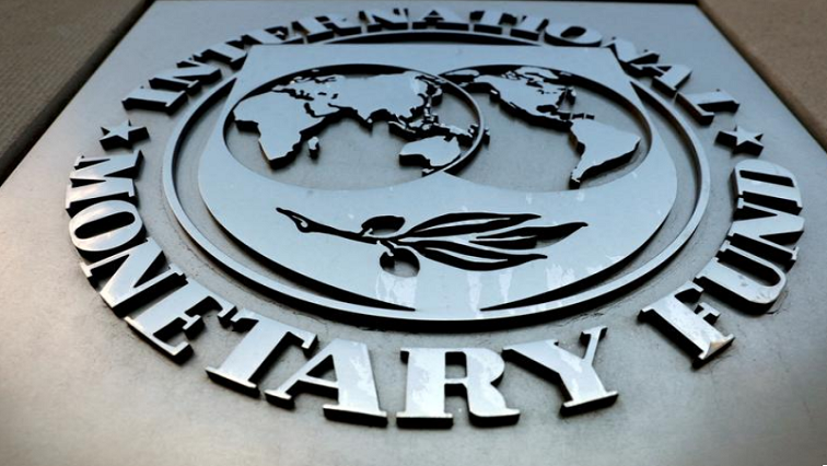 FILE PHOTO: The International Monetary Fund (IMF) logo is seen outside the headquarters building in Washington, US.