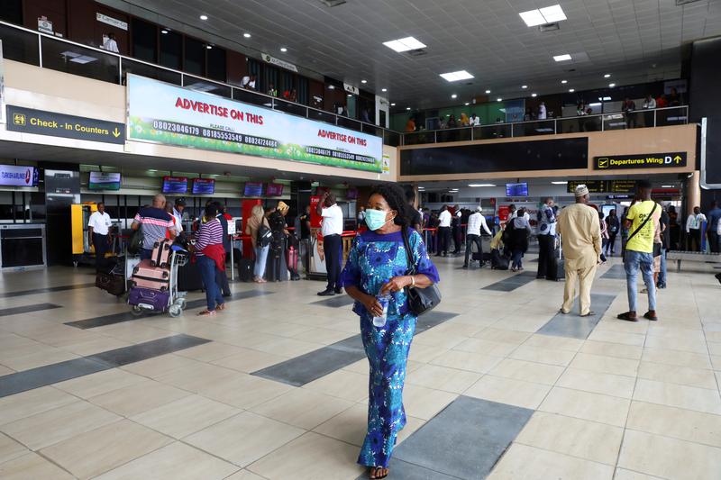 A person wearing a mask seen at a Nigerian airport