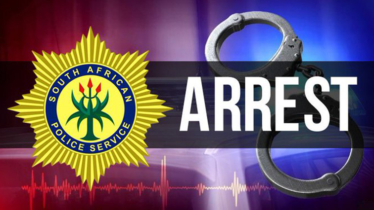 A picture of a SAPS logo and handcuffs.