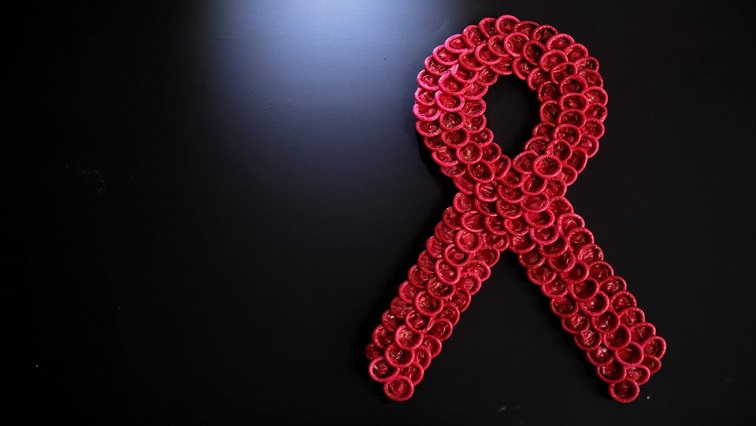 Condoms form the red ribbon, which represents the international symbol for AIDS at a wall of establishment in Sao Paulo, Brazil.