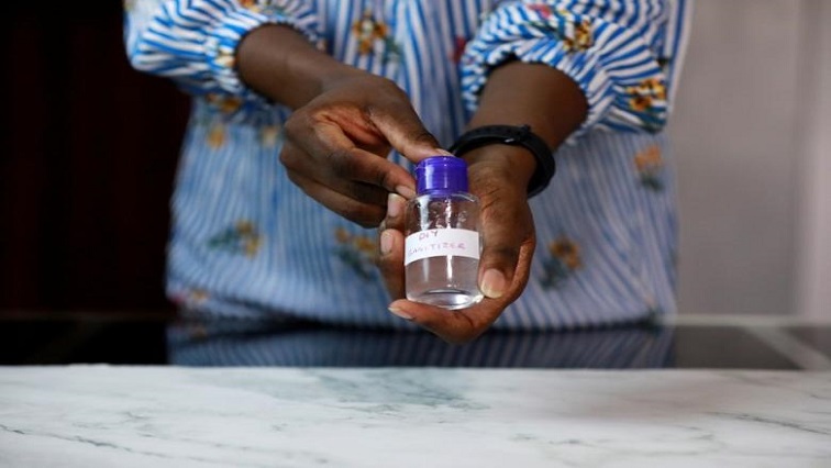 File Image: Moji Kusanu displays the finished product of the home-made hand sanitizer in her home amid precautions against coronavirus disease (COVID-19), in Lagos, Nigeria March 20, 2020.
