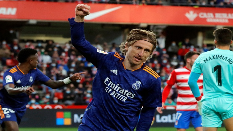 Real Madrid's Luka Modric celebrates their third goal scored by Vinicius Junior.