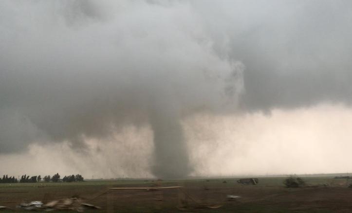 File Photo: A tornado rips through farm land in the US