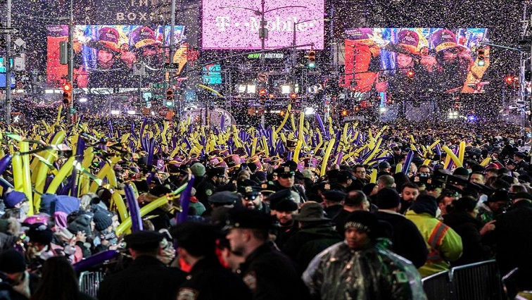 For a second year in a row, the virus that causes COVID-19 is casting a shadow over the festivities, which typically draws huge crowds to the famed intersection in midtown Manhattan.