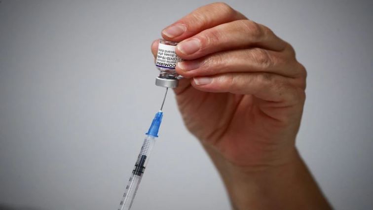 A medical worker prepares a dose of the "Comirnaty" Pfizer-BioNTech COVID-19 vaccine at a coronavirus disease (COVID-19) vaccination center in Madrid, Spain, November 24, 2021.