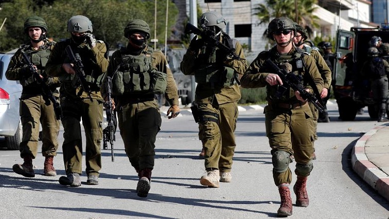 Soldiers opened fire and the car crashed into an Israeli army vehicle, setting both on fire.