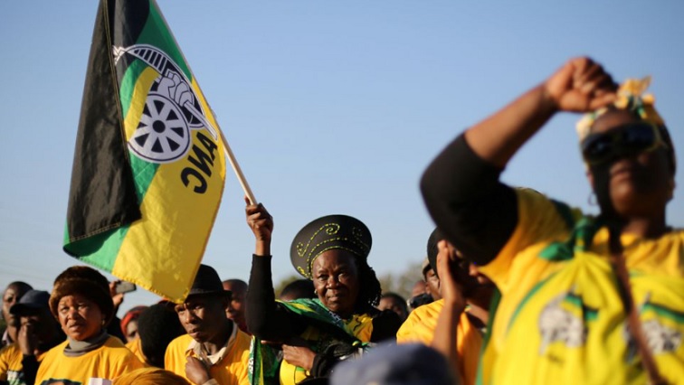 Supporters of the African National Congress hold the party flag during ANC campaign in Atteridgeville a township located to the west of Pretoria, South Africa July 5, 2016.