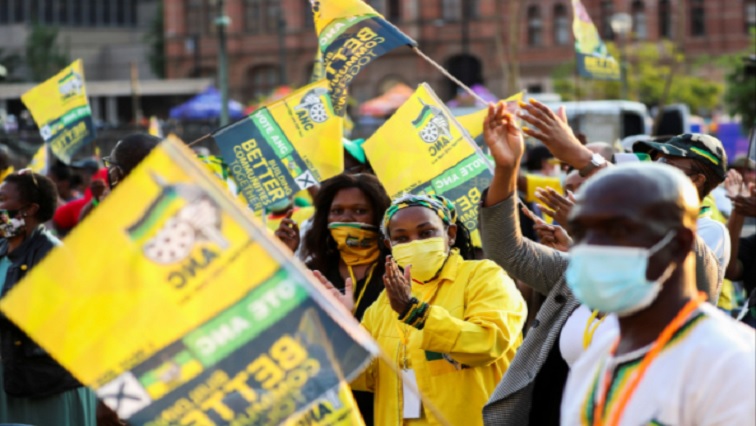 Supporters of the African National Congress holding the party's flags.