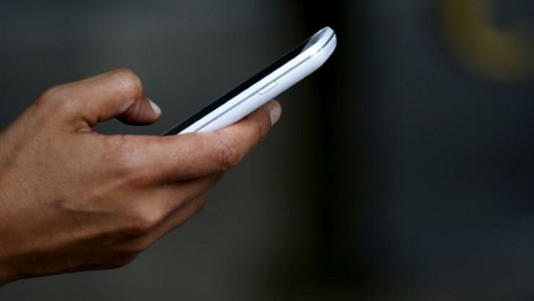A person uses a mobile device.
