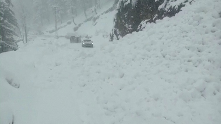 Vehicles are seen on a snowy road, in Murree, northeast of Islamabad, Pakistan in this still image taken from a video January 8, 2022.