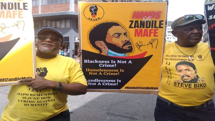AZAPO members demonstrate outside the High Court in Cape Town in support of the alleged Parliament arsonist, Zandile Mafe, January 15, 2022.