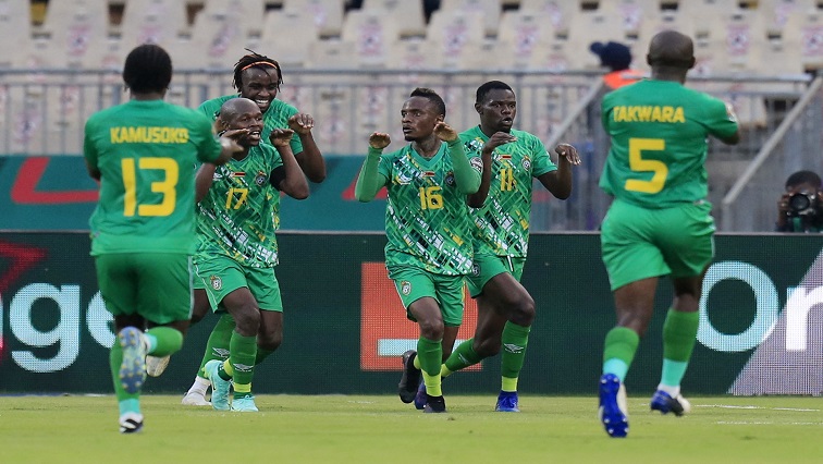 Zimbabwe's Kudakwashe Mahachi celebrates scoring their second goal with teammates.