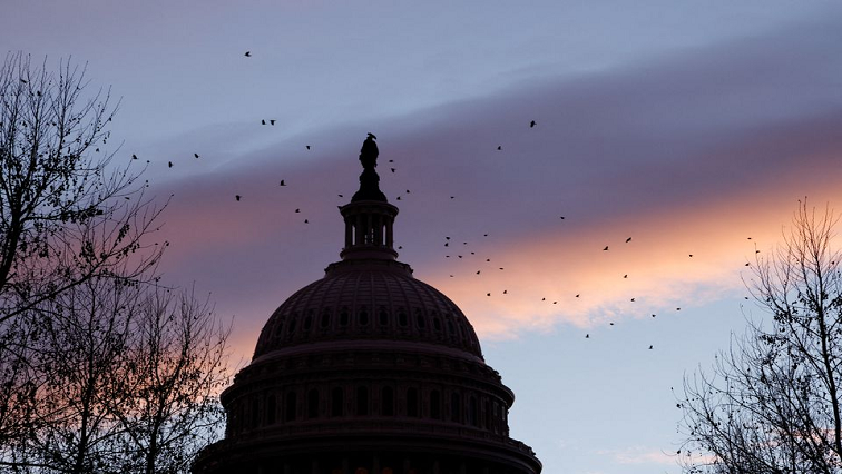 Birds fly next to the dome of the US Capitol at dawn on the first anniversary of the January 6, 2021 attack on the Capitol by supporters of former President Donald Trump, on Capitol Hill in Washington, US January 6, 2022. REUTERS/Jonathan Ernst