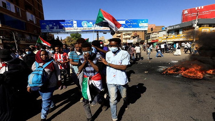 Protesters march during a rally against military rule in Sudan,.